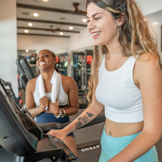 Young woman in the gym on a treadmill
